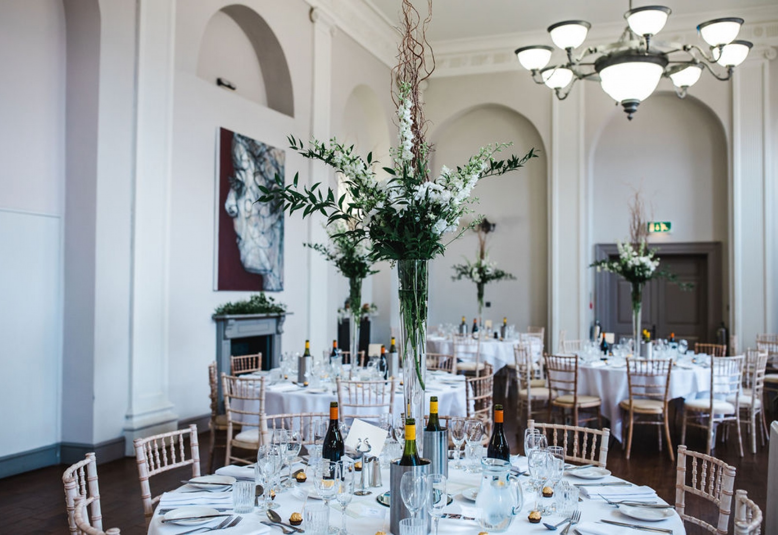 From the professionals blog on Eco-friendly weddings catering and florist Vaughan's Kitchen and Corky and Prince Swindon Wiltshire outdoor wedding tall table center pieces